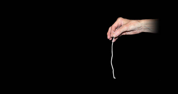 istock woman hand holding pure cotton wick 2182556785