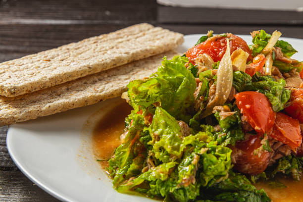 vegetable salad with tuna dressed with honey, olive oil and balsamic vinegar High quality photo