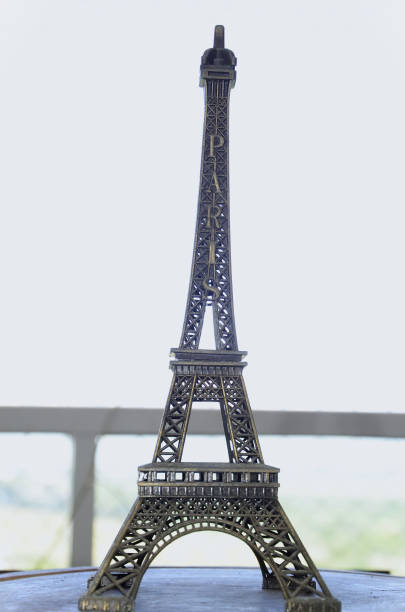 Under the wooden table a mini Eiffel Tower - Paris, in metal for decoration