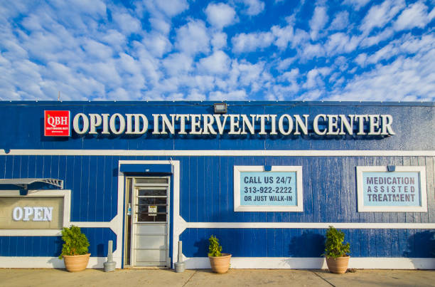 Opiod intervention center by Quality Behavioral Health in detroit, Michigan exterior view of the blue building on a partly cloudy day stock photo