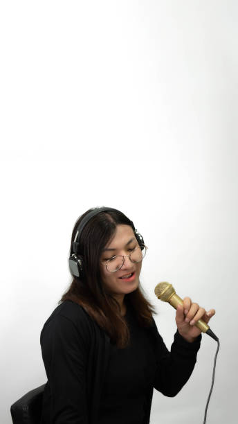 istock Woman (LGBTQ) singer sing a song with microphone 2182573442