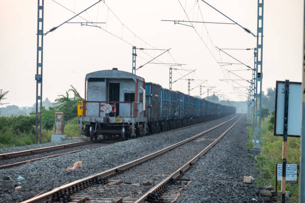 istock Railway track in India. Indian Railways Diesel-Electric Multiple Unit train 2182595058