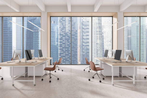 istock Modern open-space office interior with large windows showcasing a cityscape. Minimalist design with desks and chairs on a clean floor. Concept of workspace. 3D Rendering 2182598280