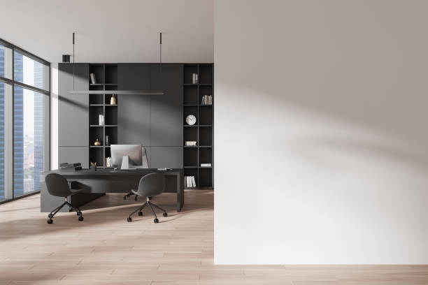 istock Office interior with work desk and pc, shelf near panoramic window. Mockup wall 2182599219