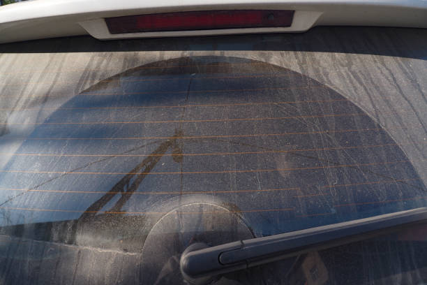 istock A Dusty Automobiles Rear Window Displaying a Unique Circular Pattern of Dirt and Grime 2182610246