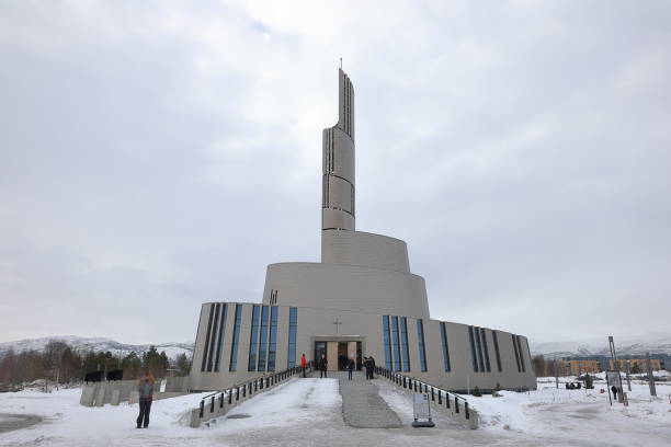 Alta, Norway - March 21:  A view of the Northern Lights Cathedral in Alta, Northern Norway on March 21st, 2024.  The church is also known as Alta Church and was consecrated on February 10th, 2013.