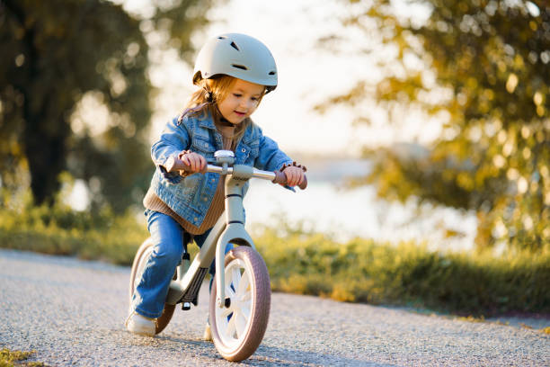 istock Happy girl riding a bicycle 2182614206