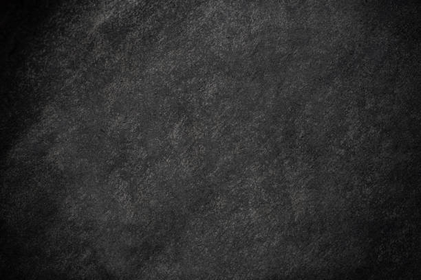 istock Black ink splashing on a dark background 2182614381