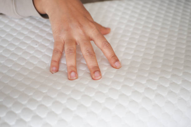 istock women hand on Orthopedic pillow on a bed 2182614941