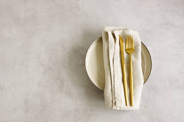 istock Modern minimal table place setting neutral beige color on beige concrete background top view with copy space. 2182615094