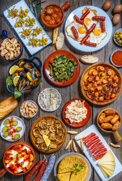istock Assorted Spanish tapas and pintxos spread on a rustic wooden table 2182616111