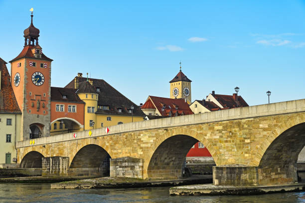 istock Old stone bridge and clock towers in Regensburg 2182617197