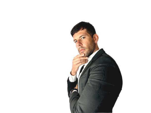 Full length portrait of young handsome business man in black suit feeling stress or depression studio isolated on white background