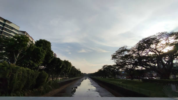 istock cloudy skies behind the city scape 2182621166