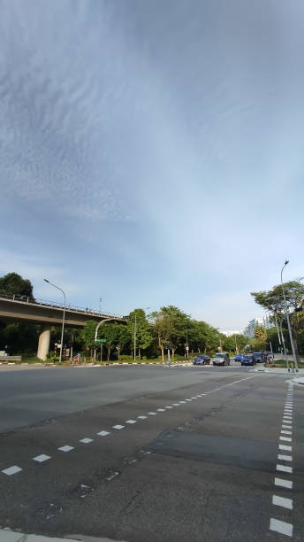istock cloudy skies behind the city scape 2182621180