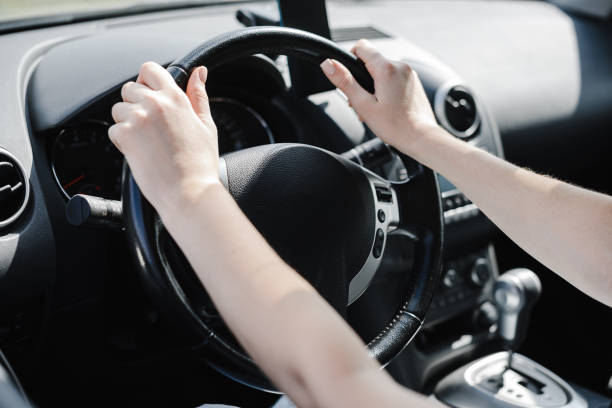 istock young woman in car 2182622067