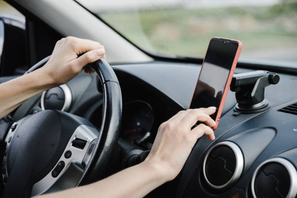 istock young woman in car 2182622092