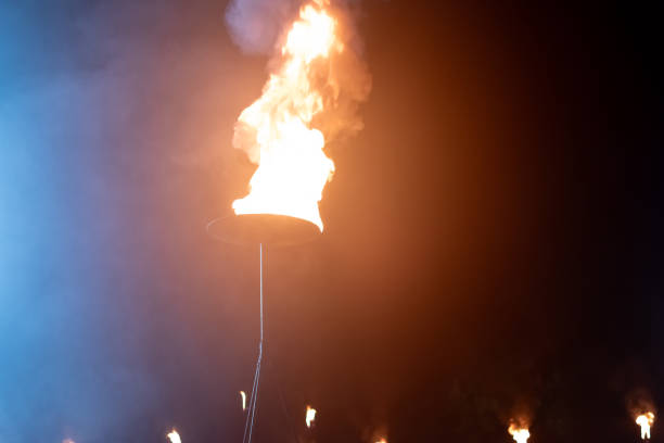 Blurred image of hot fire flame on torch at outdoor fire show