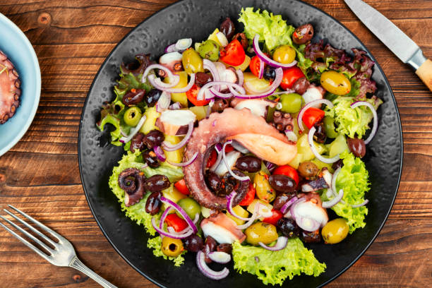 istock Exclusive salad with octopus, greens and vegetables. 2182624013