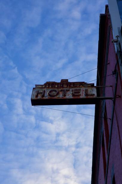 istock Vintage neon sign hanging on the building 2182625829