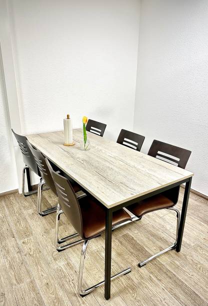 istock Modern Dining Area with Vase and Tulip on Table 2182627683