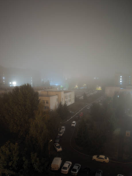 istock Autumn’s Embrace: Nighttime Fog Illuminated by City Lights 2182629319