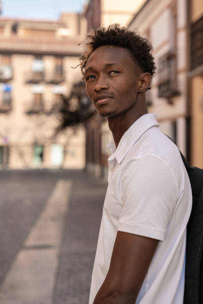 istock Young afro student going to university walking in the city 2182633573
