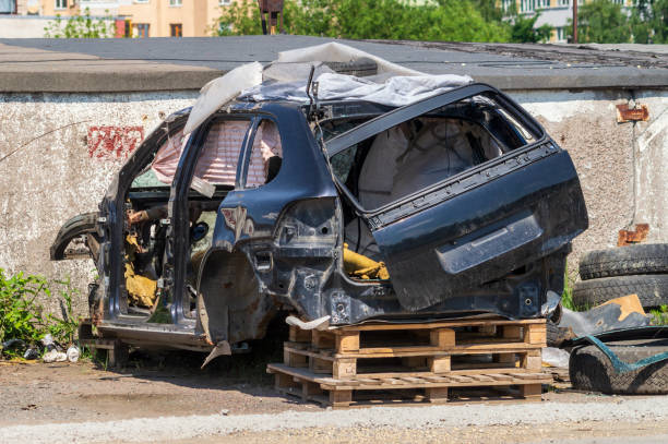 istock A black car is smashed and has its hood up 2182638745