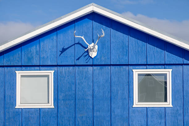 Ilulissat, Jakobshavn, Greenland, Denmark - August 31st 2024:  Reindeer antlers are a beloved trophy in the arctic and are often placed to the gables of the colorful houses