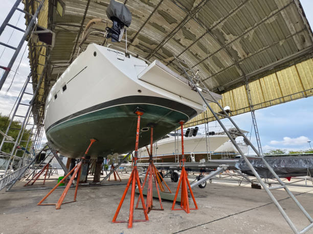 istock A boat is carefully lifted under a covered structure 2182641726