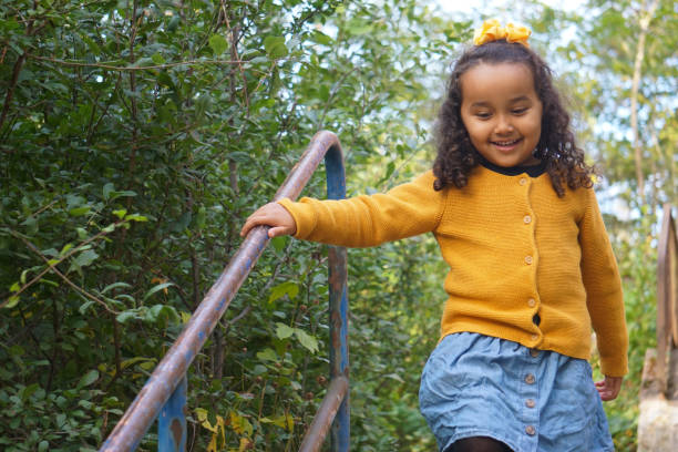 istock A little girl standing at a staircase 2182642467