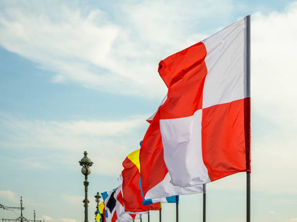 istock A row of flags with a red and white flag in the middle 2182644908