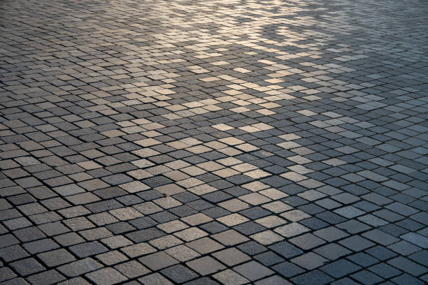 gray paved road from concrete pavers