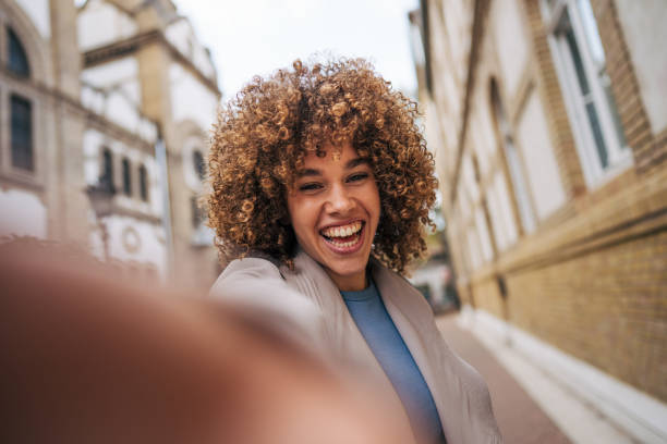 istock A cheerful female student standing outside the university. 2182646088