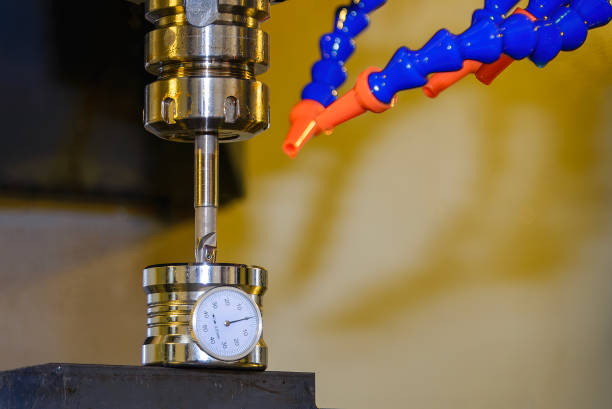 The tool length measurement operation with dial tool presetter. The tooling compensation measuring operation with dial gauges in the light blue scene.