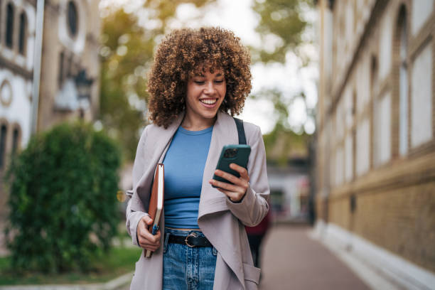 istock A cheerful female student standing outside the university. 2182648822