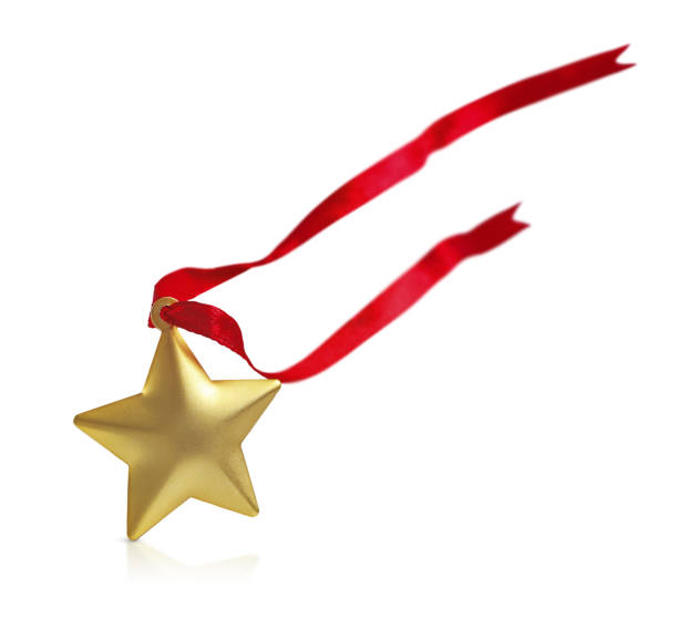 istock Golden star with soaring red ribbon is isolated on a white background 2182650446