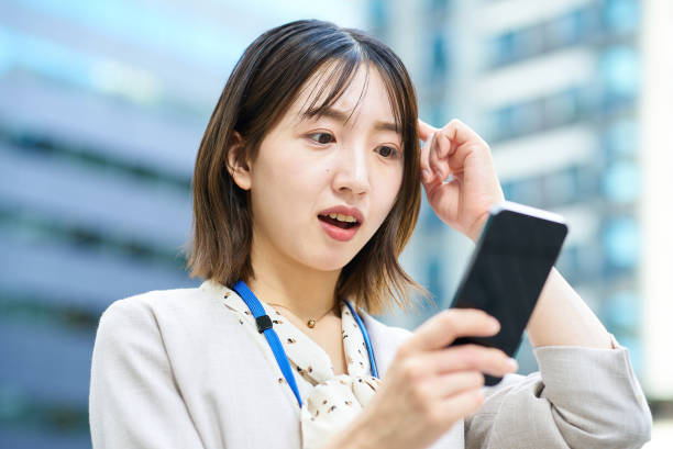 istock A young woman looking at her smartphone 2182650466