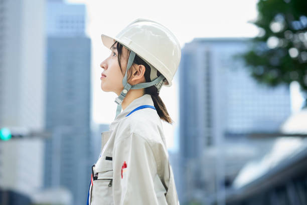 istock A young woman wearing work clothes and a helmet 2182650826