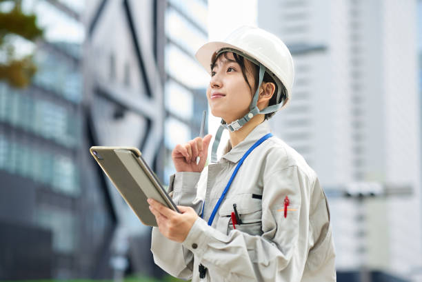 istock A young woman wearing work clothes and a helmet 2182650843