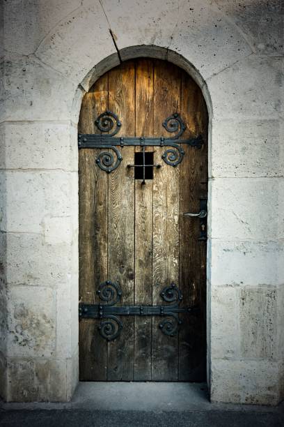 istock Rustic Wooden Door with Ornate Hinges 2182652701