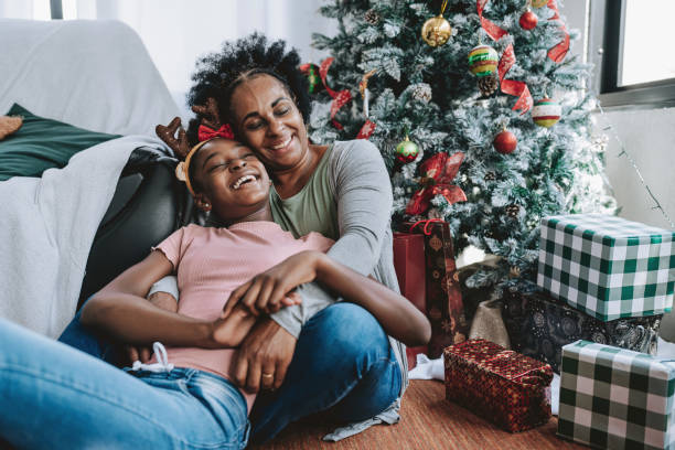 istock mother christmas gift for daughter 2182653074