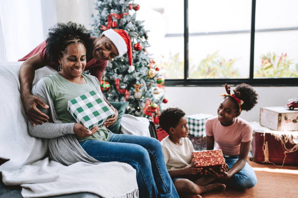 istock Christmas gift family celebrating 2182653188
