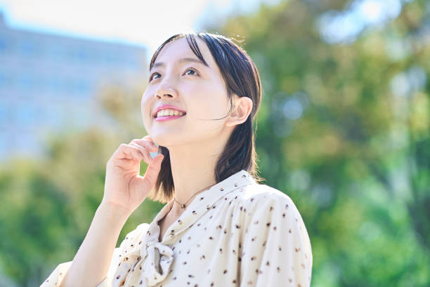 istock a young woman relaxing in green space 2182655093