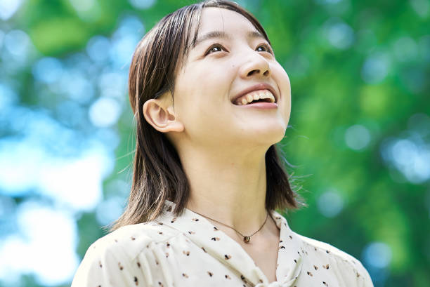 istock a young woman relaxing in green space 2182655127