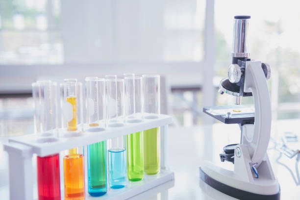 istock Science laboratory chemistry test science lab with microscope, glass tubes, chemical beaker white table scientific background. Colorful Liquid biology laboratory chemical fluid scientist experiment 2182655641
