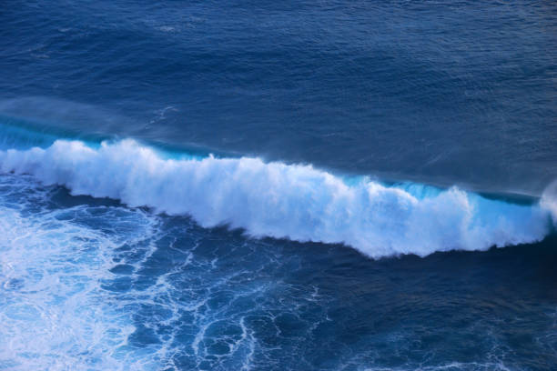 istock Turquoise ocean sea water white wave pattern splashing deep blue sea. Seascape dark ocean background wave splash on rock. Tropical sea beach in summer seaside outdoor. Water Surface blue wave pattern 2182656239