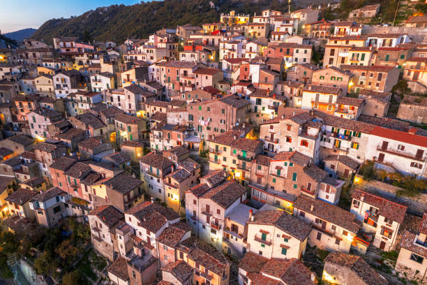 Aerial view of traditional illuminated hilltop village, Italy