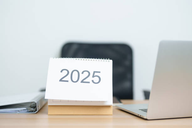 istock 2025 Year Calendar on table with laptop computer during working and writing in office. countdown, Happy New Year, Resolution, Year End and New Start and Goals Plan Action Concept 2182658578