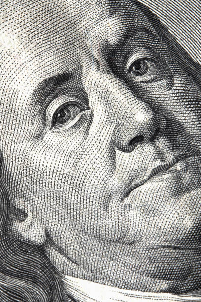 istock High resolution macro image of Benjamin Franklin on the one hundred US Dollar bill. Selective focus on eyes. 2182659394